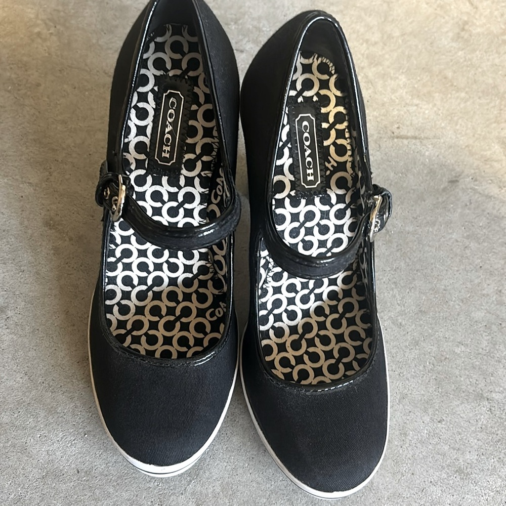 Coach black and white Cassandra pumps.